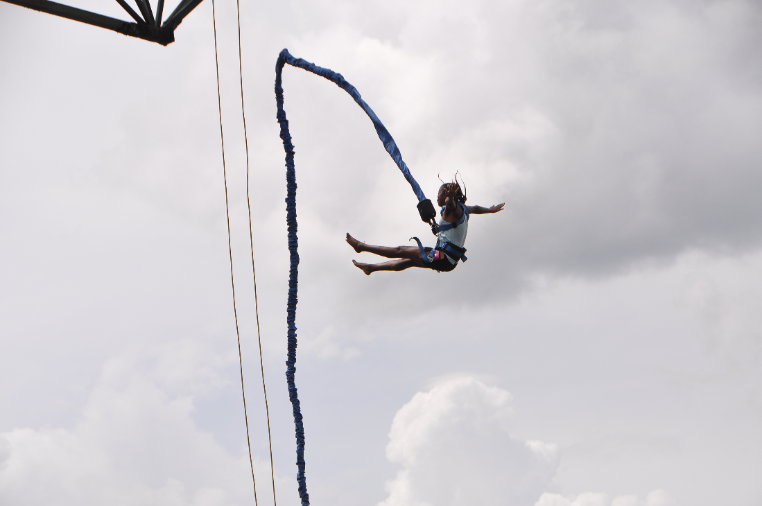 A girl bungee jumping at river Nile in Bungee Uganda
